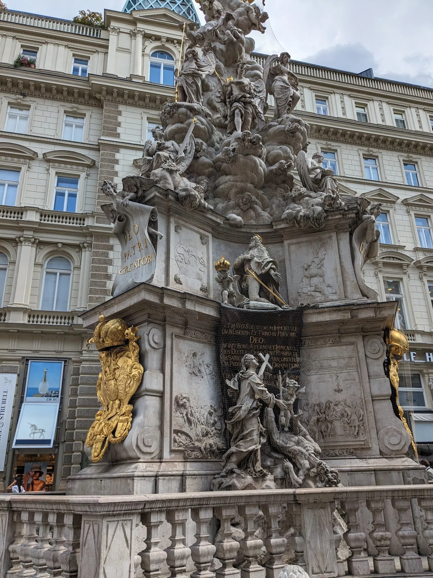 A close view of the gilded Plague Column on the Graben in Vienna